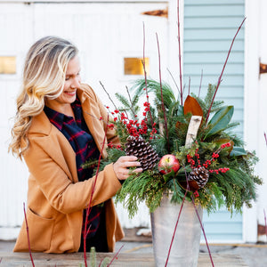 Rooted Flowers winter planter with mixed evergreens and seasonal details